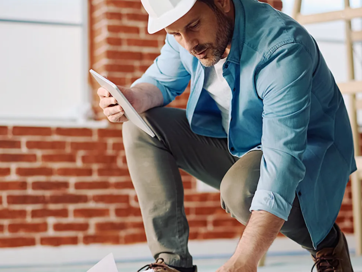 Image shows a construction worker that uses a framework for public buildings in the north